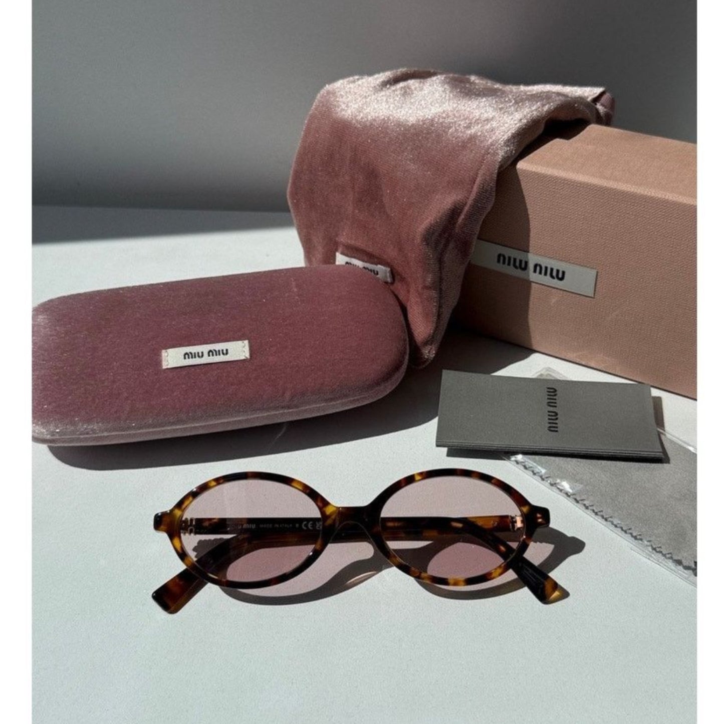 Miu Miu Oval Sunglasses
