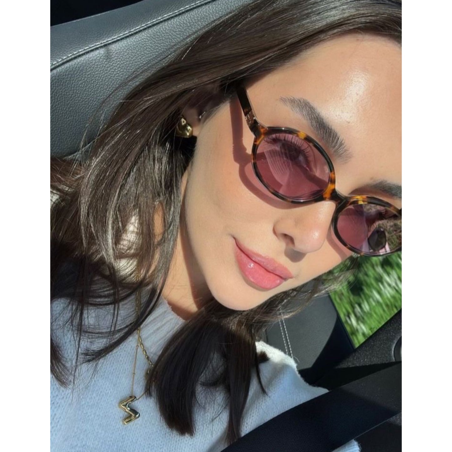 Miu Miu Oval Sunglasses