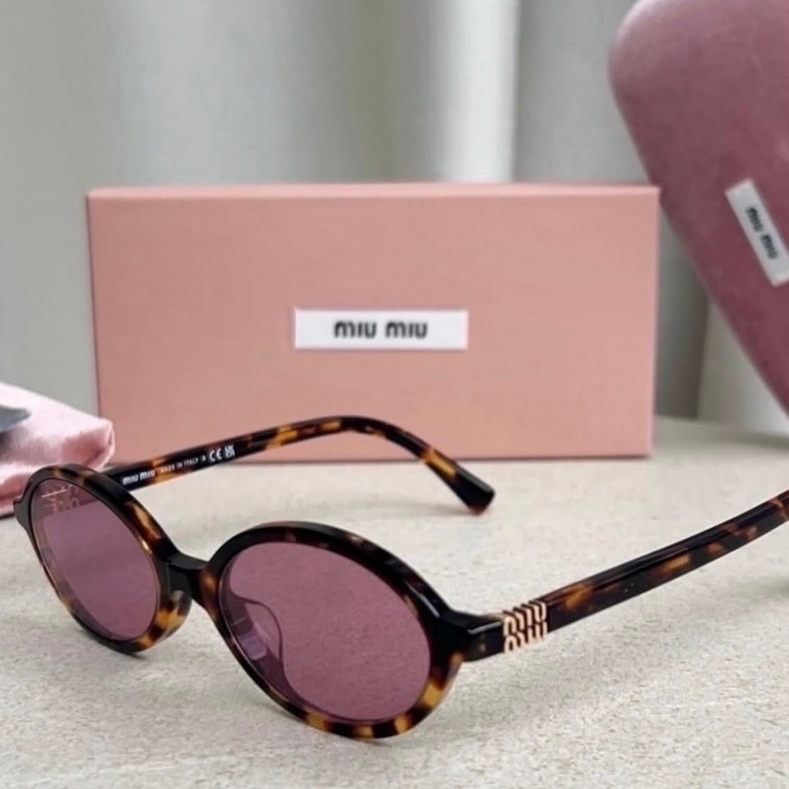 Miu Miu Oval Sunglasses